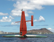 Saildrone off the coast of Honolulu with Diamond Head in the background.