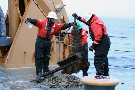 Dumping the contents of the dredge bucket on Healy's deck.